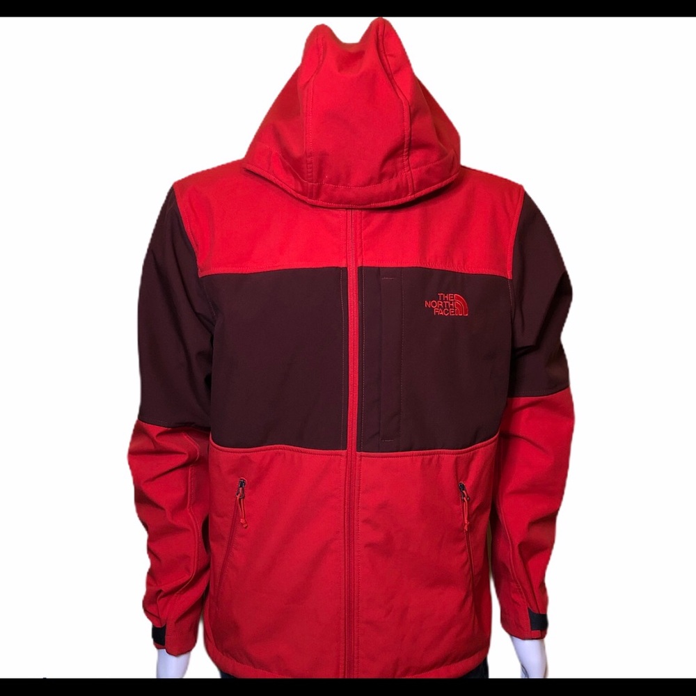 Red North Face fleece lined Windwall Jacket.